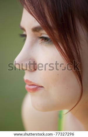 close-up profile portrait of sad young woman