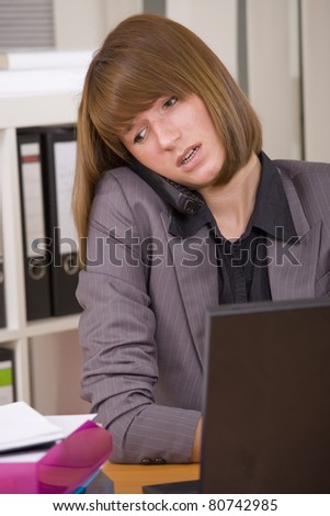 female secretary in stress by office work