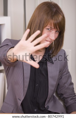 overworked business woman with stop hand sign