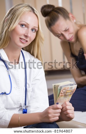 payment for treatment - doctor holding money from ill patient in background