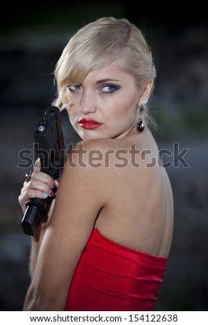 Vintage gun woman posing outdoor