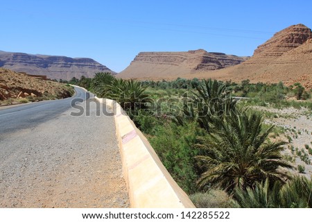 Wide view of canyon and cultivated fields and palms in Errachidia Valley Morocco North Africa Africa