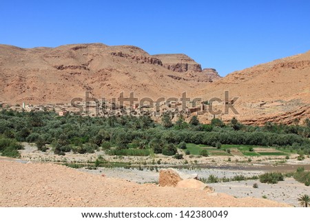 Wide view of cultivated fields and palms in Errachidia Morocco North Africa Africa, deep blue sky