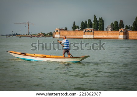 The man on the boat Venice, Italy