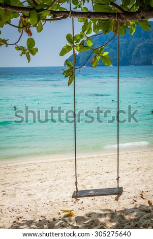 Swing hang from coconut tree over beach, Phi Phi Island, Thailand