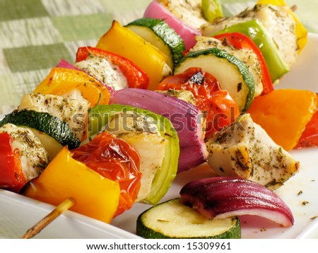Chicken kebabs with bell peppers, onions, zucchini, and cherry tomatoes