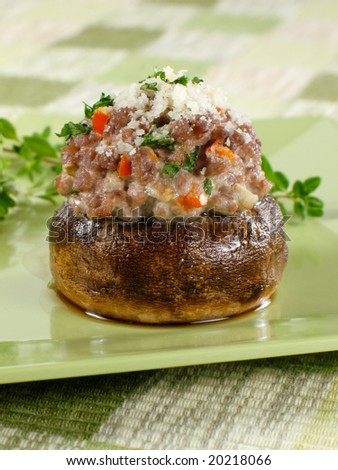 Stuffed mushroom filled with ground beef, red bell peppers, cheese, and fresh herbs.