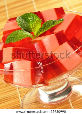 Red and pink layers of gelatin dessert and sweetened condensed milk.