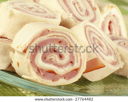 Ham and cream cheese rolled up in a flour tortilla.