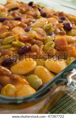 Baked bean casserole with butter beans, lima beans, kidney beans, white navy beans, and bacon.