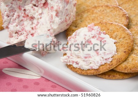 Cheese ball made with cream cheese, chipped beef, and horseradish. Served with wheat crackers.