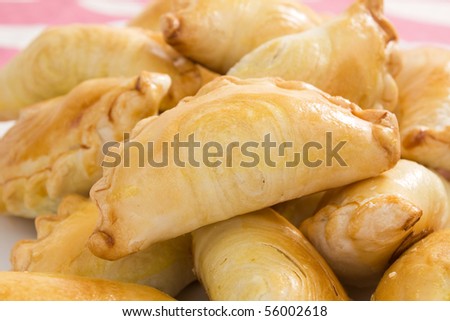 Flaky curry puffs filled with meat, potatoes, and curry.