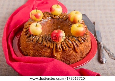 Apple cake with caramel cream, decorated with paradise apples.