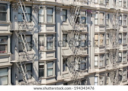 Fire escape ladder zigzagging across the face and windows. San Francisco. California. USA