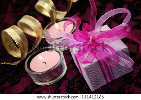 Box with a gift and candles