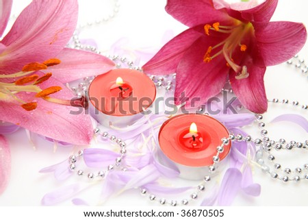 Pink lily and candles