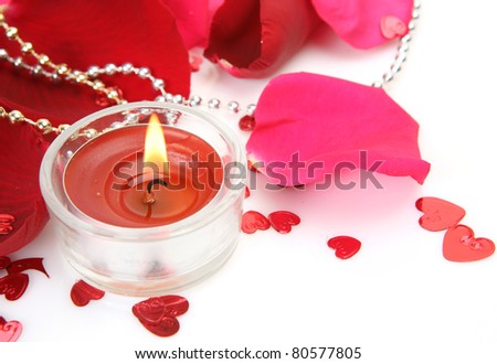 Petals of roses and candle