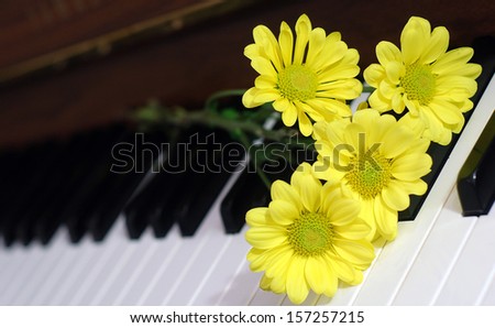 A piano with flowers on it.