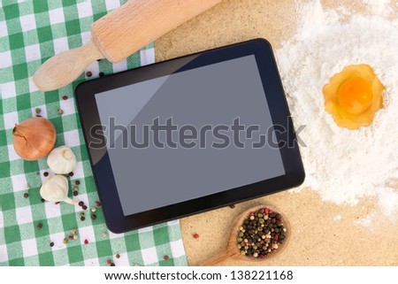 Examine Digital Recipe On Tablet At Kitchen To Prepare The Lunch