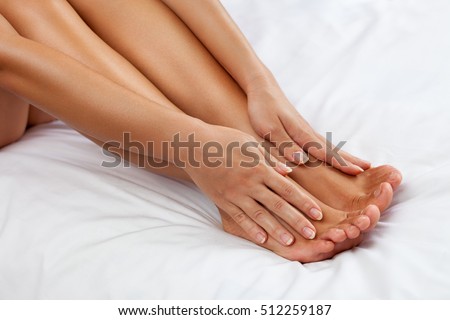 Woman massage her tired feet, healthy skin
