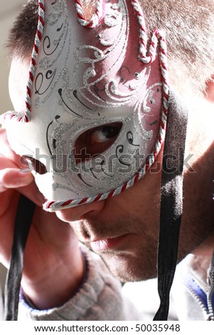 man with carnival mask close up