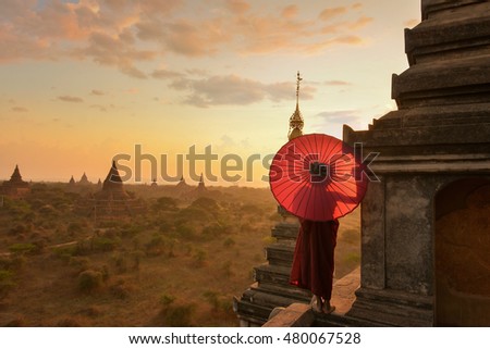 Monk relaxing in ancient temple on during sunset,Bagan Myanmar