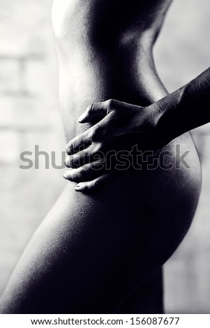black and white photo of a naked female body