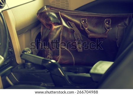 stylish leather bag inside the car