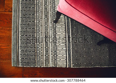 Textile armchair and knitted carpet