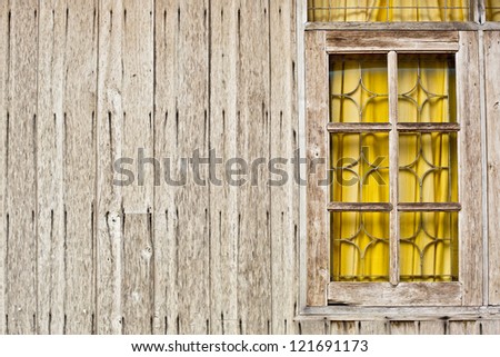 Wooden window on a wooden wall