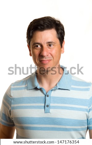 Caucasian middle aged man with blue collared shirt, short dark hair, dark brown eyes and olive skin