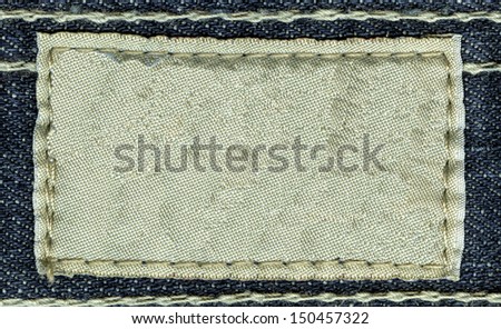 Blank  jeans label sewed on a jeans. Can be used as background for your text.