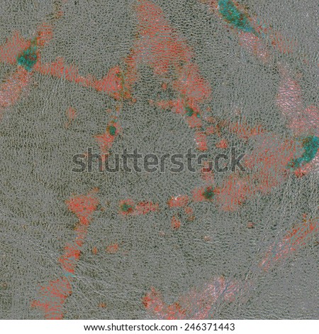 gray leather background contaminated with orange paint