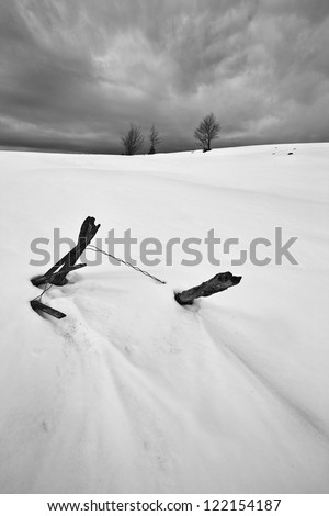 Drift. remains of an old fence, under the weight of the winter\'s snow. Salaj county, Romania.