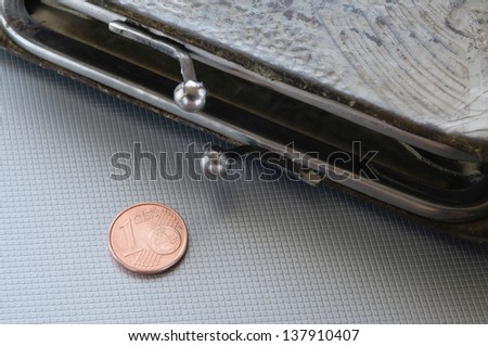 An open wallet and one cent of euro, to symbolize poverty, bankrupt