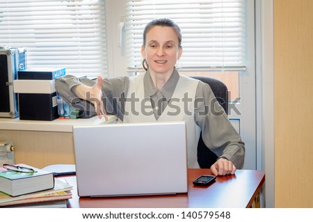 A fifty year old woman very angry with the modern technology of computer