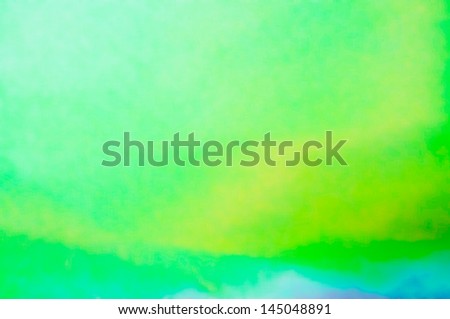 A green and light blue photographic abstract background