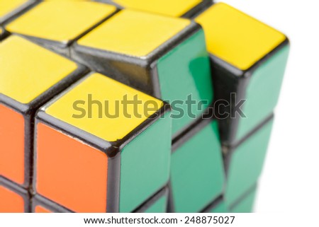KIEV, UKRAINE - DECEMBER 26, 2014: Macro detail of a Rubik\'s cube. Rubik\'s Cube on a white background. Rubik\'s Cube invented by a Hungarian architect Erno Rubik in 1974.