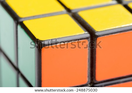 KIEV, UKRAINE - DECEMBER 26, 2014: Macro detail of a Rubik\'s cube. Rubik\'s Cube on a white background. Rubik\'s Cube invented by a Hungarian architect Erno Rubik in 1974.