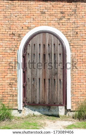 The big door old on bricks wall