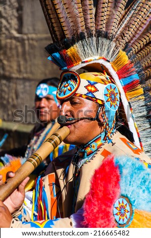 York, United Kingdom - August 9, 2014: Native American Indian tribal group play music and sing on the street in historical city of York, England.