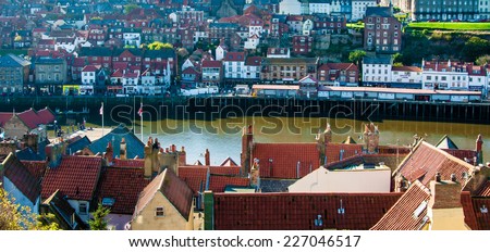 Whitby, North Yorkshire, UK - October 12, 2014: Scenic view of Whitby city in autumn sunny day.Whitby is a seaside town and port in North Yorkshire, UK
