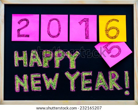 Happy New Year 2016 message hand written on blackboard, numbers stated on post-it notes, 2016 replacing 2015, corporate office celebration concept