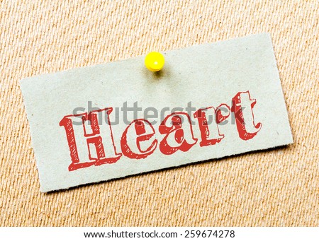 Recycled paper note pinned on cork board. Heart Message. Concept Image