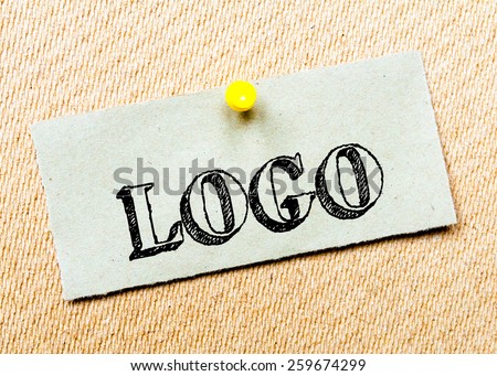 Recycled paper note pinned on cork board. Logo Message. Concept Image