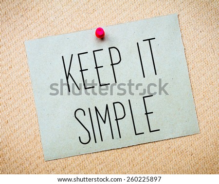Recycled paper note pinned on cork board. Keep It Simple Message. Concept Image