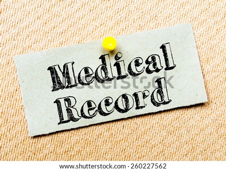 Recycled paper note pinned on cork board. Medical Record Message. Concept Image