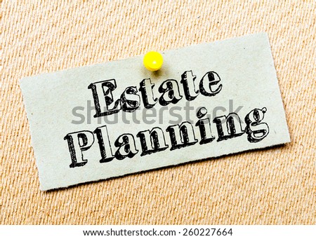 Recycled paper note pinned on cork board. Estate Planning Message. Concept Image