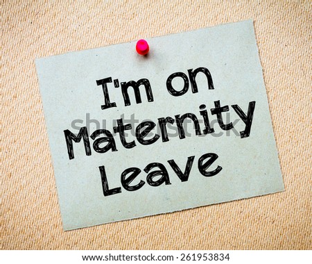 Recycled paper note pinned on cork board.I\'m on Maternity Leave Message. Concept Image