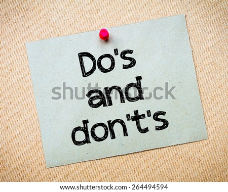 Do\'s and Don\'t\'s Message. Recycled paper note pinned on cork board. Concept Image